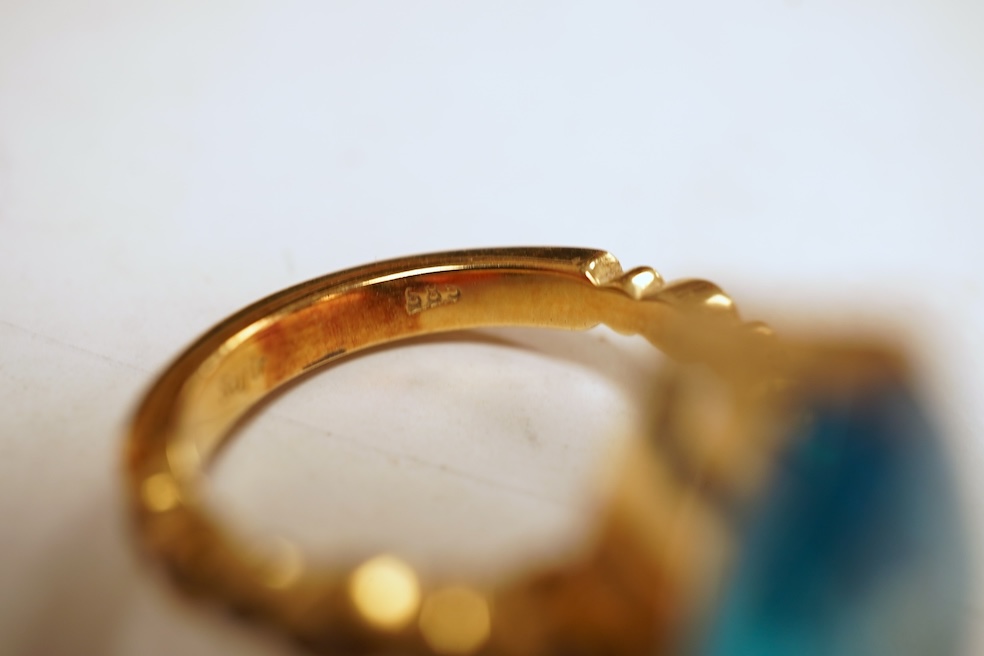 A cubic zirconia and diamond ring, set with a marquise-shaped blue cubic zirconia, to shoulders set with brilliant-cut diamonds, mounted in gold, size Q1/2, stamped 585, gross weight 8 grams, Condition: minor discolorati